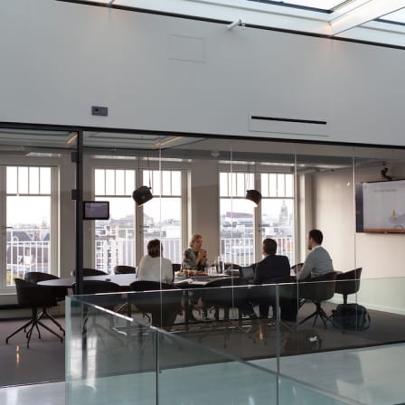 People in a conference room of a modern office